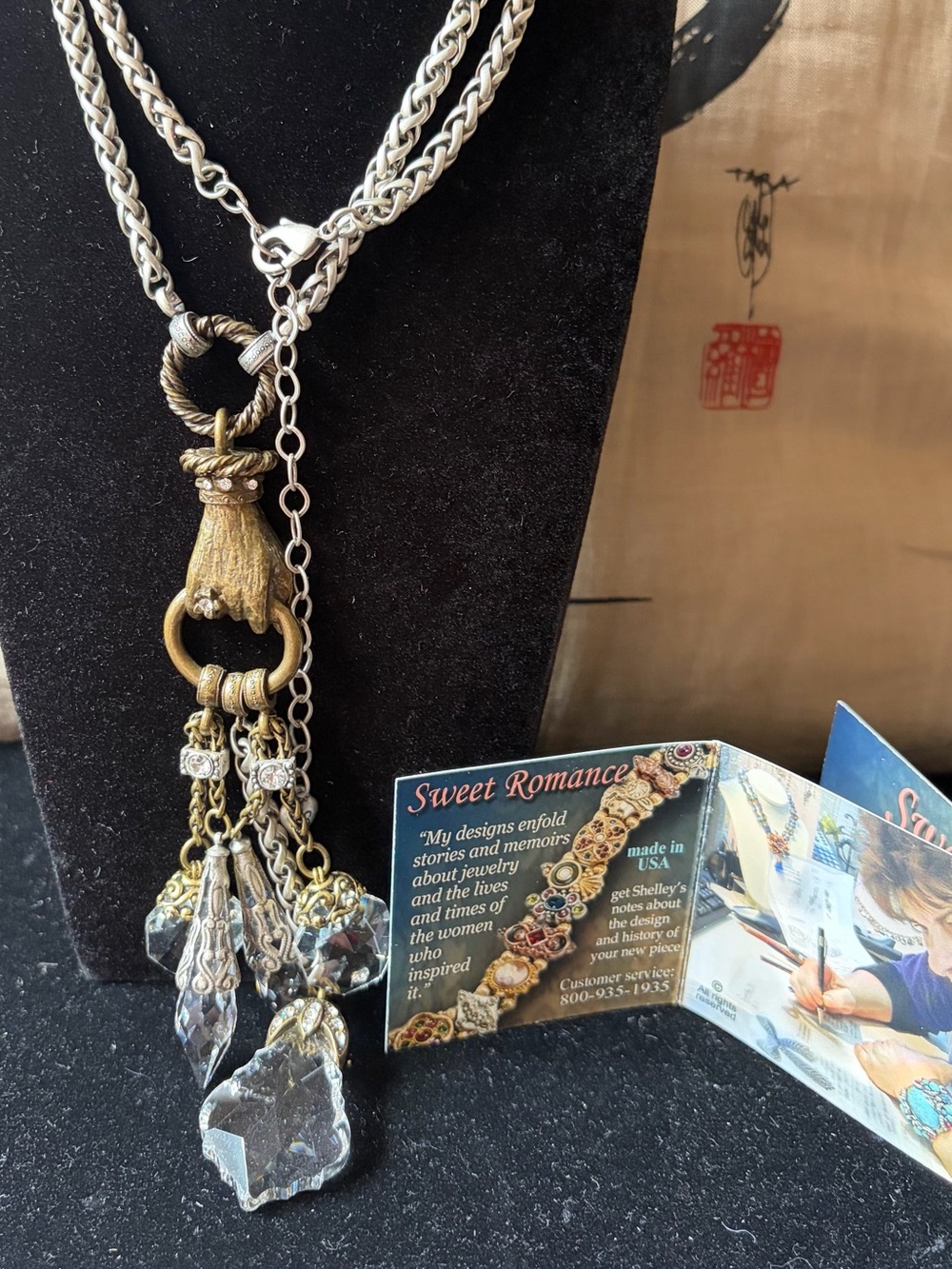 Sweet Romance Silver Tone Braid Necklace with Bronze Hand and Crystal tassels